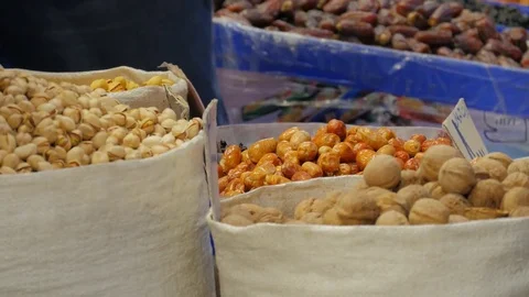 Various nuts and dry fuits for sale at Tehran Grand Bazaar, Iran Stock Footage 73687448