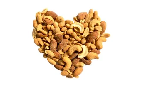 Various nuts in a heart shape isolated on white background. Top view. Stock Photos