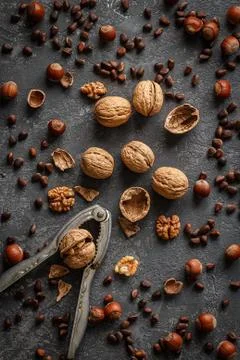 Various nuts on stone table. Top view with copy space Stock Photos