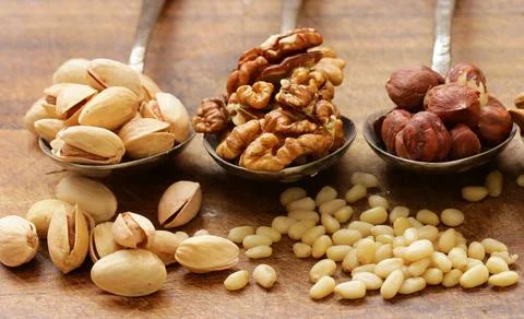 Various nuts (walnuts, cashews, almonds) assorted for healthy eating Stock Photos