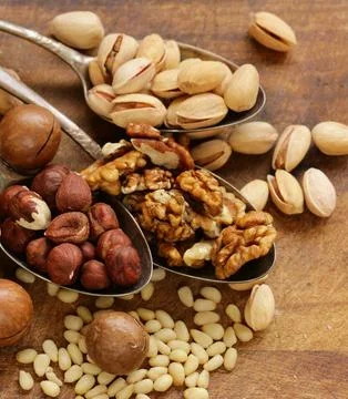 Various nuts (walnuts, cashews, almonds) assorted for healthy eating Stock Photos