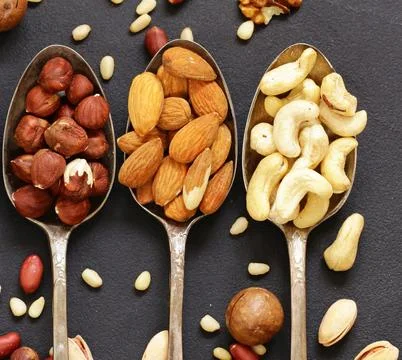 Various nuts (walnuts, cashews, almonds) assorted for healthy eating Stock Photos