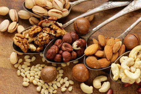 Various nuts (walnuts, cashews, almonds) assorted for healthy eating Stock Photos