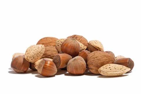Various nuts on a white isolated background Stock Photos