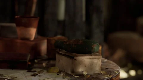 Various objects on a wooden table in a rustic setting Stock Footage 345002631