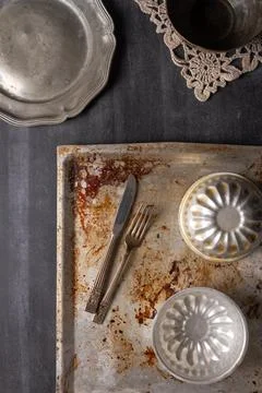 Various old kitchen objects on black chalkboard background Stock Photos