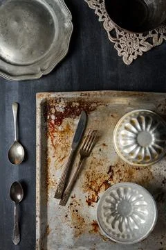 Various old kitchen objects on black chalkboard background Stock Photos