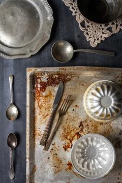 Various old kitchen objects on black chalkboard background Stock Photos