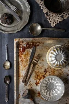 Various old kitchen objects on black chalkboard background Stock Photos