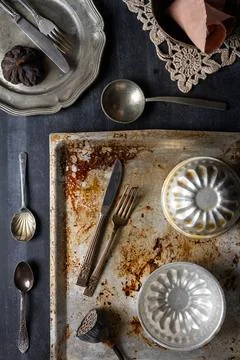 Various old kitchen objects on black chalkboard background Stock Photos