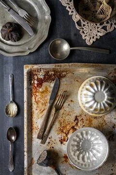 Various old kitchen objects on black chalkboard background Stock Photos