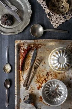 Various old kitchen objects on black chalkboard background Stock Photos