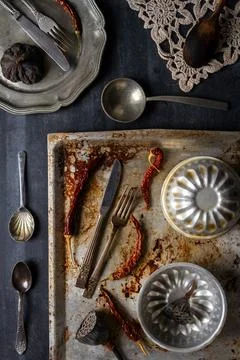 Various old kitchen objects on black chalkboard background Stock Photos