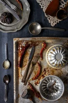 Various old kitchen objects on black chalkboard background Stock Photos