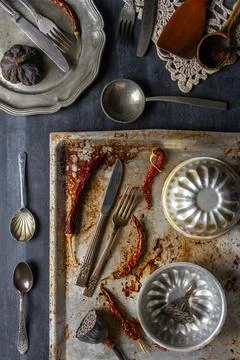 Various old kitchen objects on black chalkboard background Stock Photos
