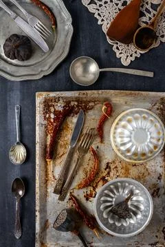 Various old kitchen objects on black chalkboard background Stock Photos
