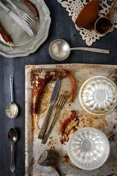 Various old kitchen objects on black chalkboard background Stock Photos