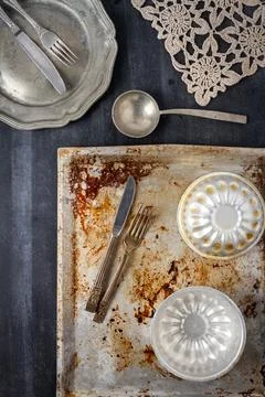 Various old kitchen objects on black chalkboard background Stock Photos