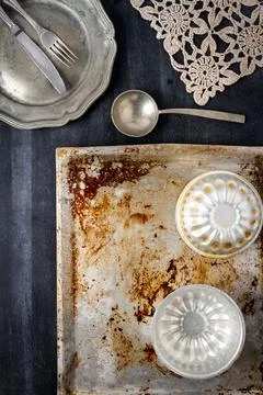 Various old kitchen objects on black chalkboard background Stock Photos