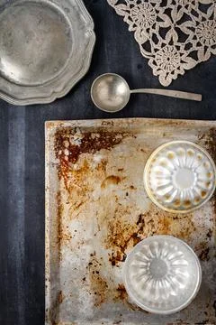 Various old kitchen objects on black chalkboard background Stock Photos