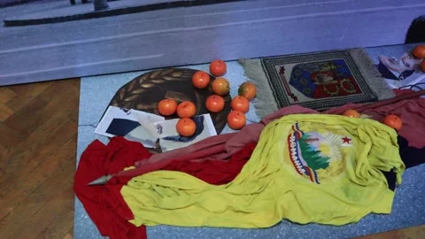 Various old objects  on a blue carpet within the history museum in Brasov Stock Footage 195210272