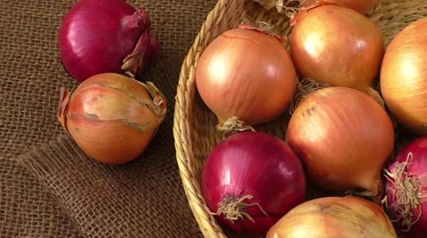 Various onions on a background sacking, burlap Video stock 59186593