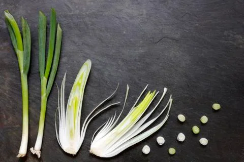 Various onions on slate Stock Photos