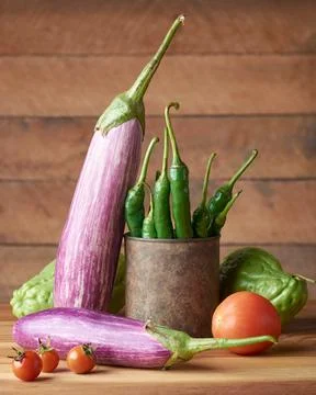 Various organic vegetables on a table top Stock Photos