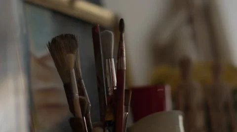 Various paint brushes in painting studio Stock Footage 65872474