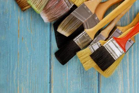 Various paint tools brush on white wooden table background Stock Photos
