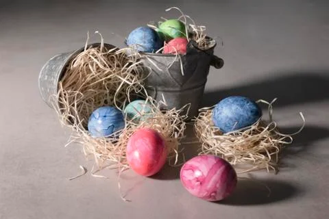 Various painted easter eggs with metal buckets Stock Photos