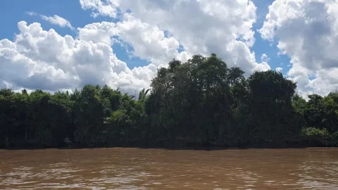 Various patterns of white clouds in the blue sky above the Kapuas River 스톡 동영상 337226214