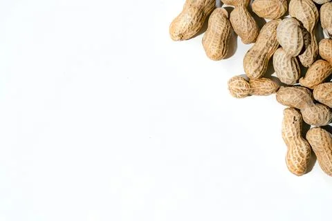 Various peanuts with shell on white background. copy space Stock Photos
