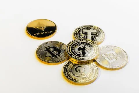 Various Physical Cryptocurrency Coins Grouped on White Background Foto stock