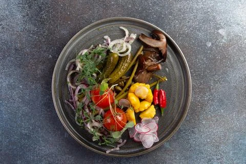 Various pickled vegetables in a plate. Stock Photos