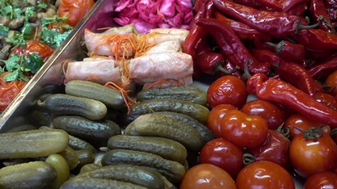 Various pickles and snacks in trays on the counter. Stock Footage 113352589
