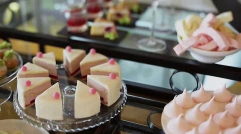 Various pieces of cake on a table Stock Footage 56869509