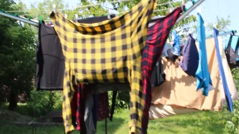 Various pieces of laundry on the dryer Stock Footage 245554463