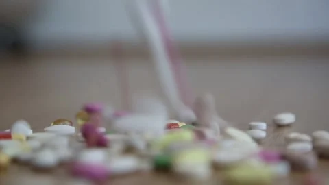 Various Pills and Capsules Falling Down Stock Footage 341126920