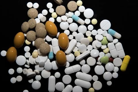 Various pills on a black background Stock Photos
