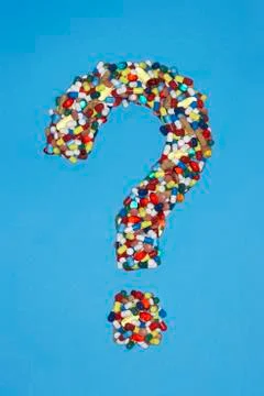 Various pills forming question mark on blue background Stock Illustration