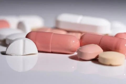 Various pills on a white surface Stock Photos