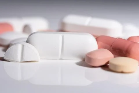 Various pills on a white surface Stock-Fotos