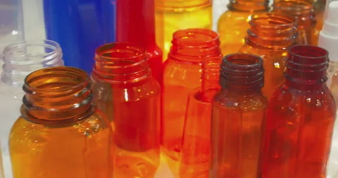 Various plastic products are displayed close-up on the exhibition display case. Video stock 329182408
