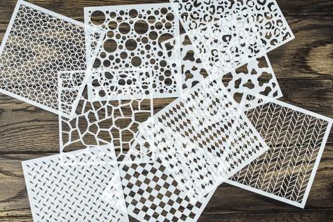 Various plastic stencils on table Fotos de archivo