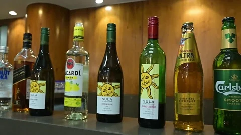 Various popular alcohol and beverage bottles Stock Footage 346383077