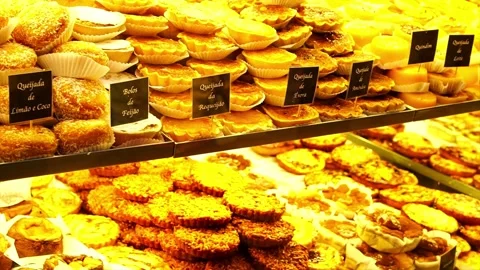 Various Portuguese sweets in the show window of a pastry shop Stock Footage 239945156