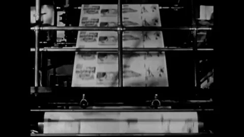 Various printing presses are shown in work that includes letterpress printing, Stock Footage 83138525