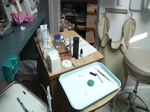 Various Quick Pans Across Dentist Working Area Stock Footage 1099657