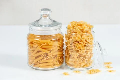 Various raw pasta types on white background Stock Photos